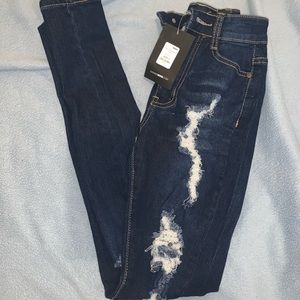 Fashion Nova dark blue ripped jeans